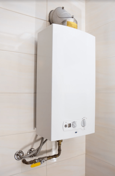 A tankless water heater on a wall 