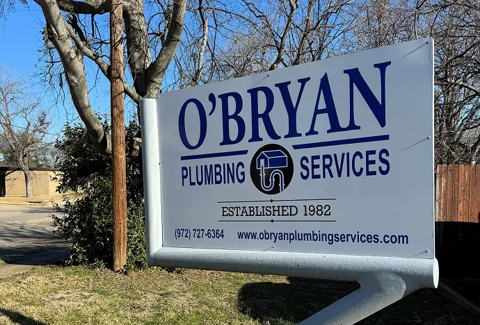 Kitchen with white cabinets, granite counters, and large window over counters.