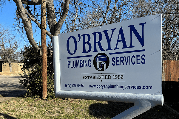 Close-up view of water going down a clean drain.
